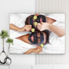 Mẫu tranh spa đẹp hình ảnh hai cô gái đắp mặt nạ màu đen nằm tạo dáng với những miếng dưa chuột