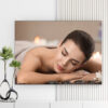 Mẫu tranh spa đẹp hình ảnh cô gái đẹp nằm thư giãn trên giường spa, phía trước đặt bông hoa và những viên đá cuội
