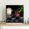 Mẫu tranh spa thiên nhiên đẹp khổ vuông hình ảnh cành hoa lan, nến thơm và đá cuội